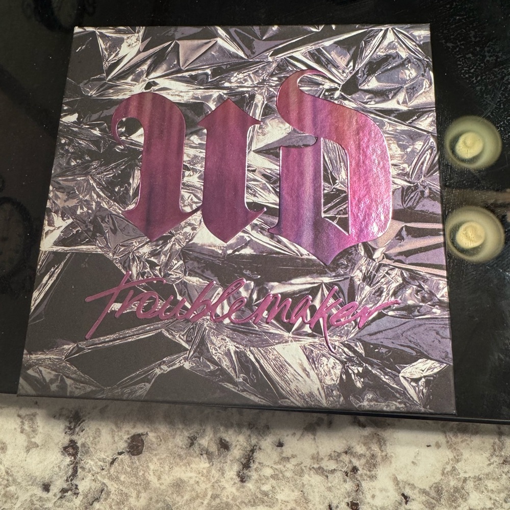 Urban Decay Troublemaker Palette with Purple and Black Design